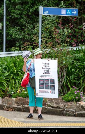 Former independent candidate for the Federal seat of Bradfield and recently the state seat of Davidson, Janine Kitson is seen here protesting at Gordon Station on Sydney's North Shore in Australia. Ms Kitson is upset, like many residents of the area at proposed rezoning of residential and commercial properties within a 400m range of the railway line by the Chris Minns led Labor State Government. Current single level dwellings, some in heritage zones are to be reclassified as 6-8 storey apartment blocks thereby hopefully reducing Sydney's housing deficit Stock Photo