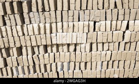 Raw traditional Indonesian bricks being dried in the sun Stock Photo