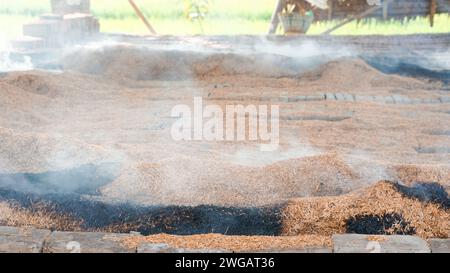 brick burning using dry husks somewhere in Indonesia Stock Photo