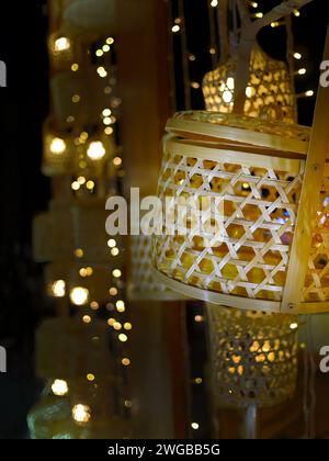 Close up bamboo weaving lamp, Illuminated Lamp, decorative product, home decor, local hand craft, selective focus with bokeh background Stock Photo