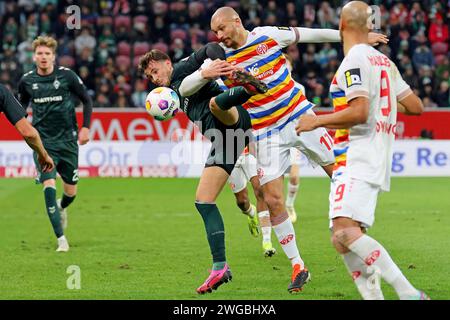 Mainz, Deutschland. 03rd Feb, 2024. Mainz, Deutschland 03. Februar 2024: 1. BL - 2023/2024 - FSV Mainz 05 vs. SV Werder Bremen Im Bild: v. li. im Zweikampf: Olivier Deman (Bremen) gegen Ludovic Ajorque (Mainz). // DFL regulations prohibit any use of photographs as image sequences and/or quasi-video // Credit: dpa/Alamy Live News Stock Photo