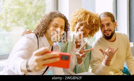 Coworkers taking a selfie during a work break Stock Photo