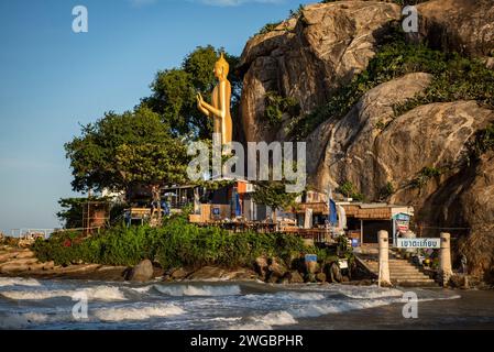 the Beach with the standing Buddha at Wat Khao Takiab near the City of Hua Hin in the Province of Prachuap Khiri Khan in Thailand,  Thailand, Hua Hin, Stock Photo