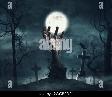 Hand rising out from the grave Stock Photo - Alamy