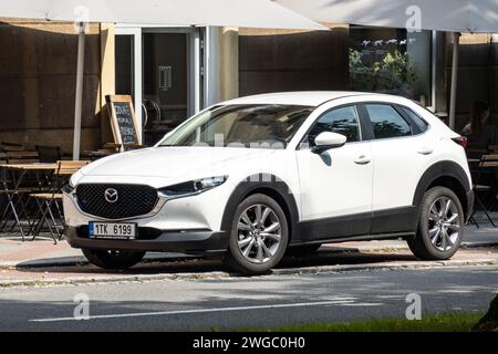 OSTRAVA, CZECH REPUBLIC - Mazda CX-30 compact crossover in white colour parking in front of restaurant Stock Photo