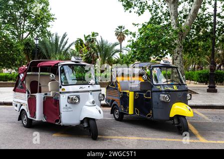 Palermo, Italy - May 13, 2023: Tricycles of the Piaggio brand that make tourist circuits parked on a street in the old town of Palermo, Sicily, Italy Stock Photo