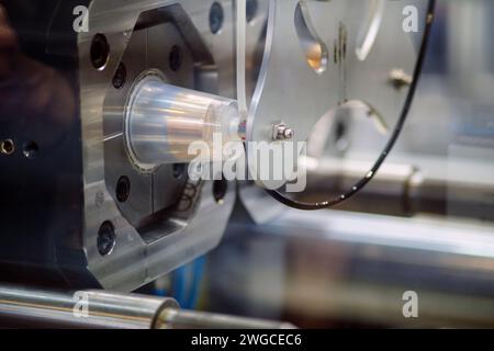 The process of manufacturing plastic products in automated production Stock Photo