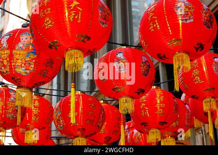 Chinese Lunar New Year red lanterns 恭喜發財 with gold tassels floating in the air Stock Photo