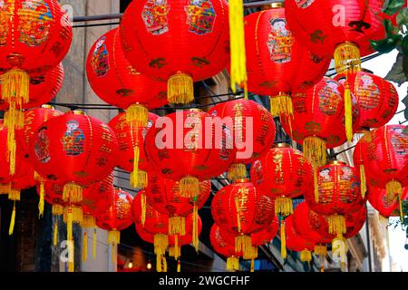 Chinese Lunar New Year red lanterns 恭喜發財 with gold tassels floating in the air Stock Photo