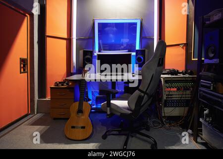 A sound engineer's workplace in a recording studio with a computer and an armchair Stock Photo