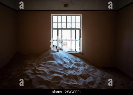 The Sand covering the floor of an abandoned building in an old desert town Stock Photo