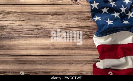 American Flag Draped Over a Rustic Wooden Surface Symbolizing Patriotism and Heritage Stock Photo