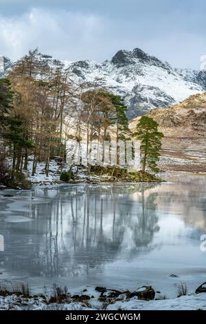 Icy reflections in Blea Tarn Stock Photo