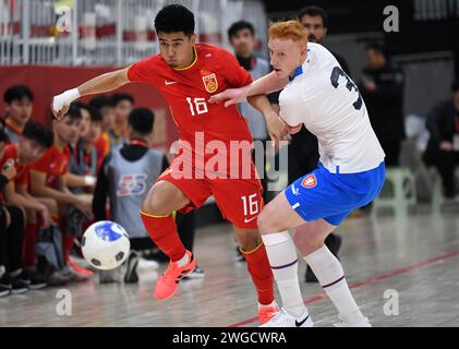 Yulin, China's Shaanxi Province. 4th Feb, 2024. Sai Yidaer (L) of China vies with Tomas Kuchta of the Czech Republic during a match at the CFA 'Yulin Tourism Investment' Cup Futsal International Tournament 2024 in Yulin, northwest China's Shaanxi Province, Feb. 4, 2024. Credit: Li Yibo/Xinhua/Alamy Live News Stock Photo