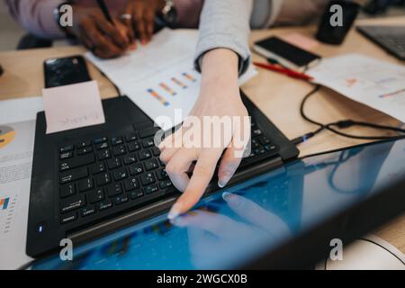 Diverse business professionals collaborate, discuss marketing strategies, and analyze market segmentation for financial growth. Stock Photo