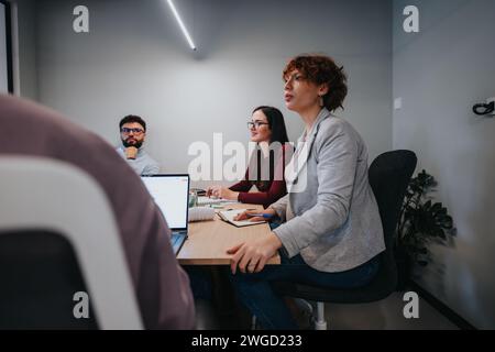 Business professionals collaborating in a creative office. Stock Photo