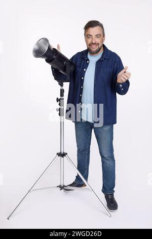 Full isolated studio picture from a photographer with a studio flash unit Stock Photo
