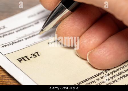 Completing tax documents PiT 37 (personal income tax) concept, Taxes in Poland, Annual settlement of individuals Stock Photo