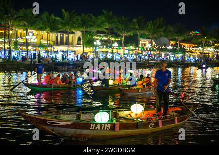 Illuminated Lantern Boats on the Thu Bon river at night, Hoi An, Vietnam Stock Photo