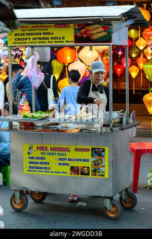 Street Food Vendors at Hoi An Night Market, Hoi An, Vietnam Stock Photo