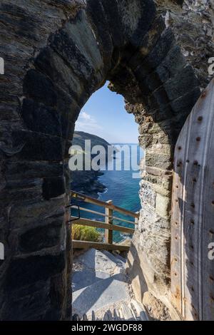 Castle door and steps down to the coast at Tintagel Castle Stock Photo