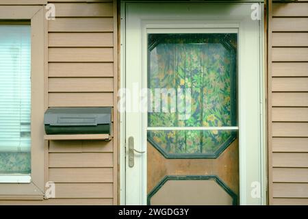 A door with curtains in Westfield, New York Stock Photo