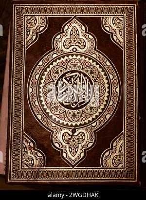 embossed gold on Maroon leather cover of a Koran or Quran in a mosque Stock Photo