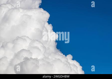 White clouds floating in a clear blue sky Stock Photo