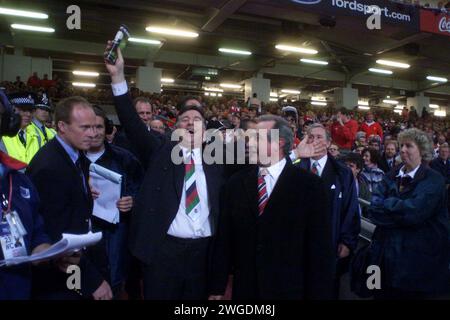 File photo dated 01-10-1999 of Former Wales players Barry John (centre) and Gareth Edwards (right) enjoy the opening ceremony of the 1999 Rugby World Cup. Former Wales and British and Irish Lions fly-half Barry John has died aged 79, his family have said in a statement. Issue date: Sunday February 4, 2024. Stock Photo