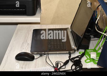 The computer is left on on the desk in the office, everything is ready to work. Stock Photo