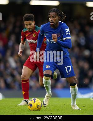 Chelsea’s Carney Chukwuemeka (right) goes past Wolverhampton Wanderers' Joao Gomes during the Premier League match at Stamford Bridge, London. Picture date: Sunday February 4, 2024. Stock Photo