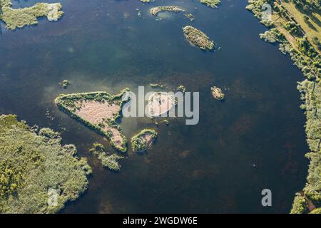 A shallow body of water with islands, photographed from above, the bottom is clearly visible. Stock Photo