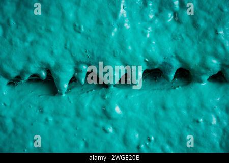 Detail of a colorful spray paint graffiti on a concrete wall Stock Photo