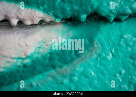 Detail of a colorful spray paint graffiti on a concrete wall Stock Photo