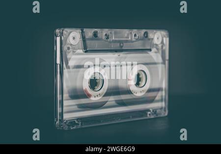 Old vintage cassette tapes on black background. Single classic audio cassette tape. Stock Photo