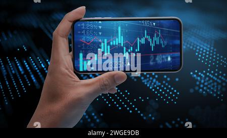 Mans hand holding cell phone with stock charts on screen with high tech background Stock Photo
