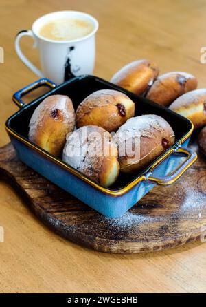 Homemade donuts filled with marmalade sprinkled with powdered sugar Stock Photo