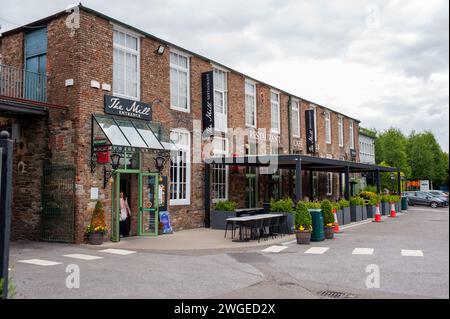 Former wool mill with a small hotel, a restaurant & a shop selling Irish sweaters & Celtic jewelry. Stock Photo