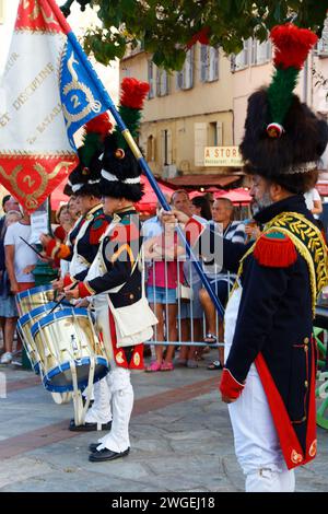 The reenactors dressed as Napoleonic soldiers for celebration the Napoleon birthday who was born in Ajaccio. Corsica island. Stock Photo