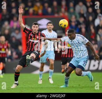 Bournemouth, UK. 30th Jan, 2024. Bournemouth, England, Feb 4th 2024: Bournemouth's Marcos Senesi (left) crosses the ball despite the attentions of Nottingham Forest's Taiwo Awoniyi (right) during the Premier League football match between Bournemouth and Nottingham Forest at the Vitality Stadium in Bournemouth, England (David Horton/SPP) Credit: SPP Sport Press Photo. /Alamy Live News Stock Photo