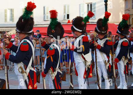 The reenactors dressed as Napoleonic soldiers for celebration the Napoleon birthday who was born in Ajaccio. Corsica island. Stock Photo