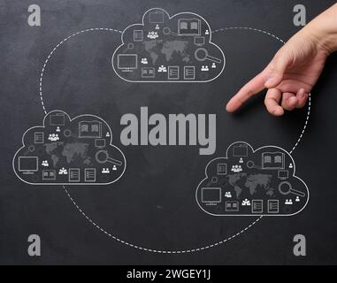 Cloud data storage and businessman's hand. The concept of information exchange, creating a backup copy Stock Photo
