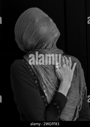 Shrouded woman in B&W Stock Photo