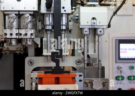 Close up of plastic injection blow molding machine. Selective focus. Stock Photo