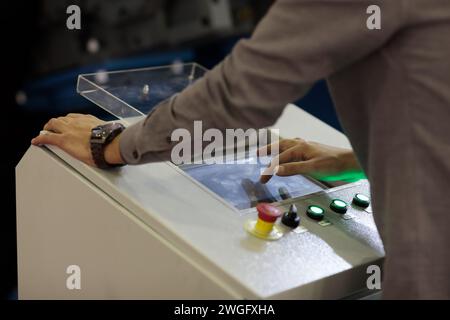 Working with industrial touchscreen control panel. Selective focus. Stock Photo
