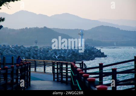 Samcheok City, South Korea - December 28, 2023: The beginning of the Chogok Yonggul Cave Hiking Trail, with the tetrapod breakwater of Chogok Port and Stock Photo
