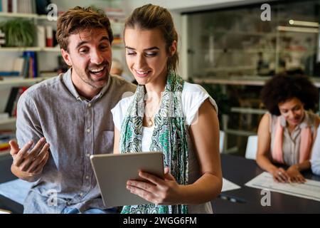 Programmers cooperating at IT company developing apps. People business work office concept Stock Photo