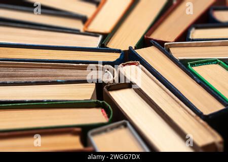 Many different hardcover old books on dark background, top view, selective focus Stock Photo