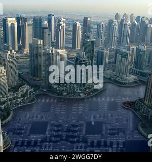Modern city with skyscrapers standing on an electronic board with IC, active and passive components. Smart city concept. Stock Photo