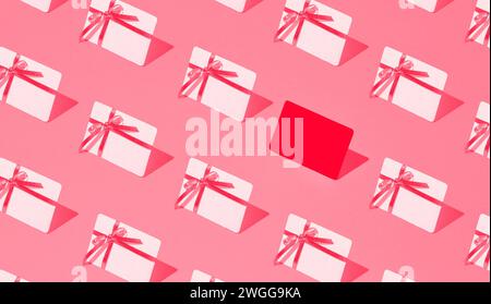 Isometric pattern of credit cards, gift cards, bonus cards. consumer concept, on a red background. Gifts for Valentine, woman, mother Day and birthday Stock Photo